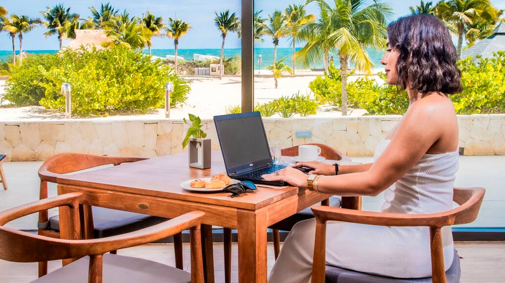 Woman-working-on-laptop-in-The-Club